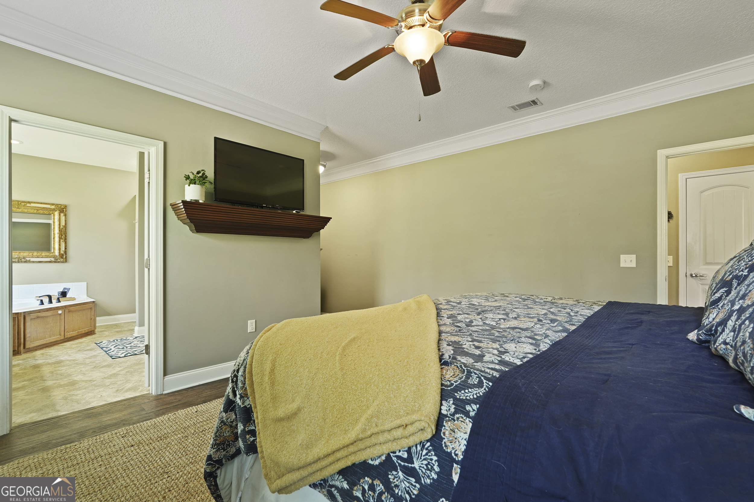 1653 Sutherland Road Townsend, GA 31331 - Photo 37 of 73 a bedroom with a bed and flat screen tv
