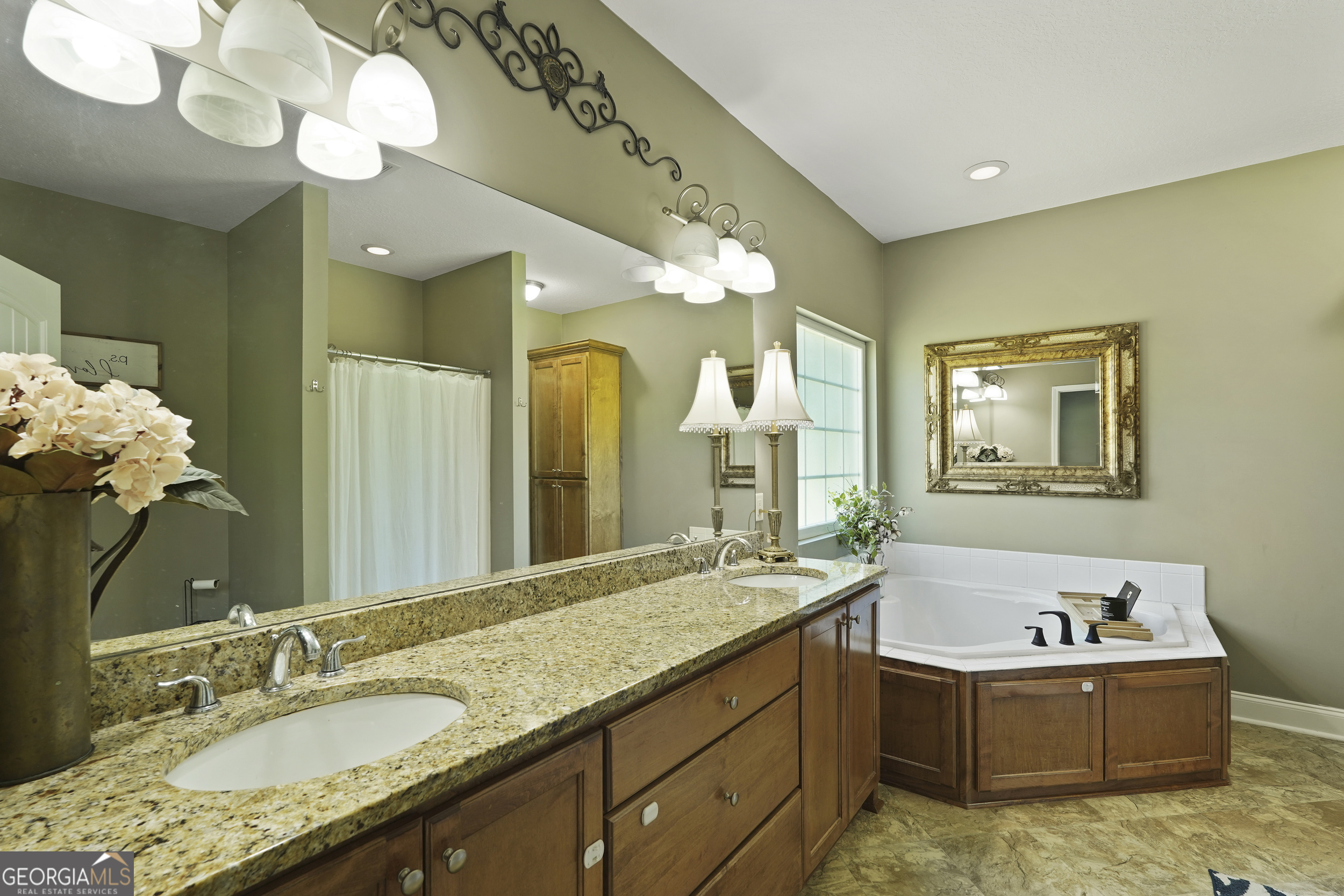 1653 Sutherland Road Townsend, GA 31331 - Photo 38 of 73 a bathroom with a granite countertop sink and a mirror