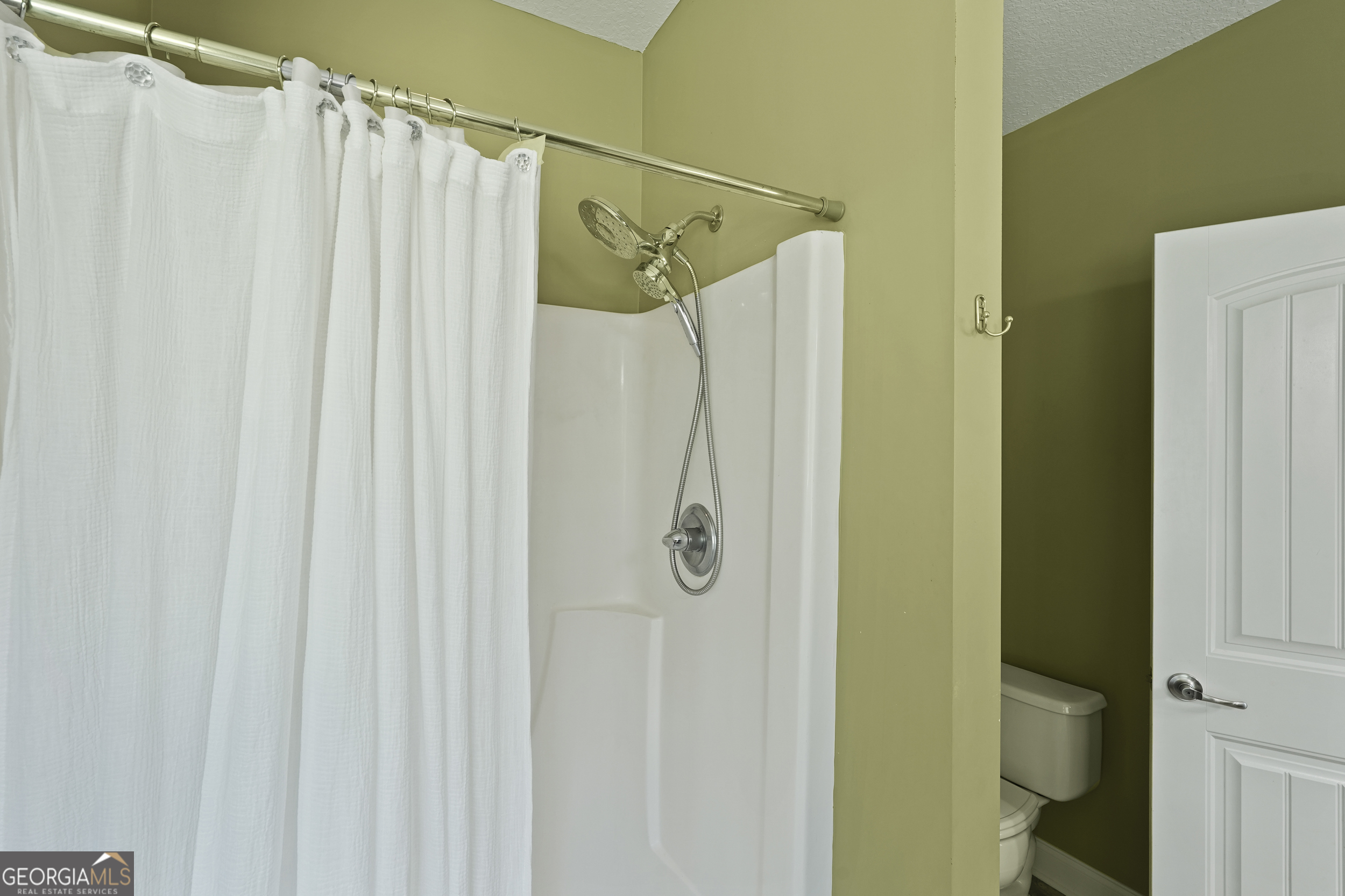 1653 Sutherland Road Townsend, GA 31331 - Photo 42 of 73 a bathroom with a shower and a shower curtain