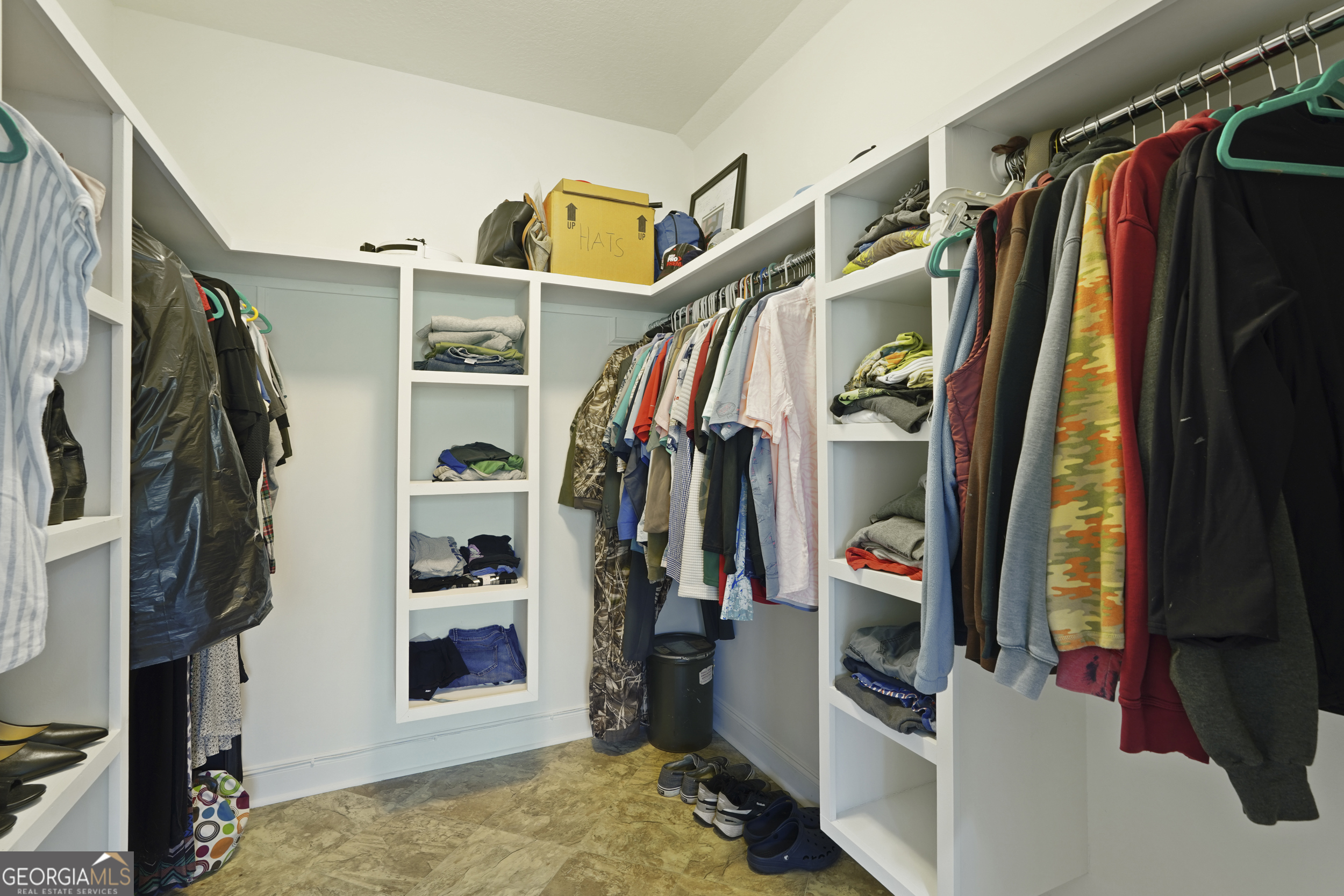 1653 Sutherland Road Townsend, GA 31331 - Photo 44 of 73 a view of walk in closet with clothes and shoes