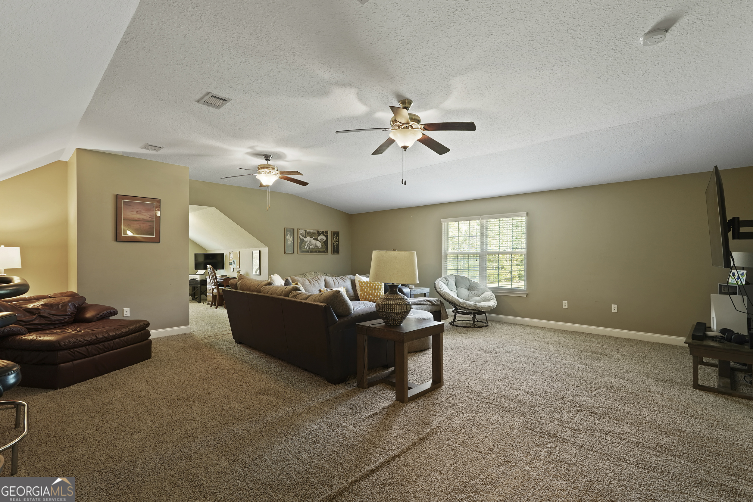 1653 Sutherland Road Townsend, GA 31331 - Photo 46 of 73 a living room with furniture window and a flat screen tv
