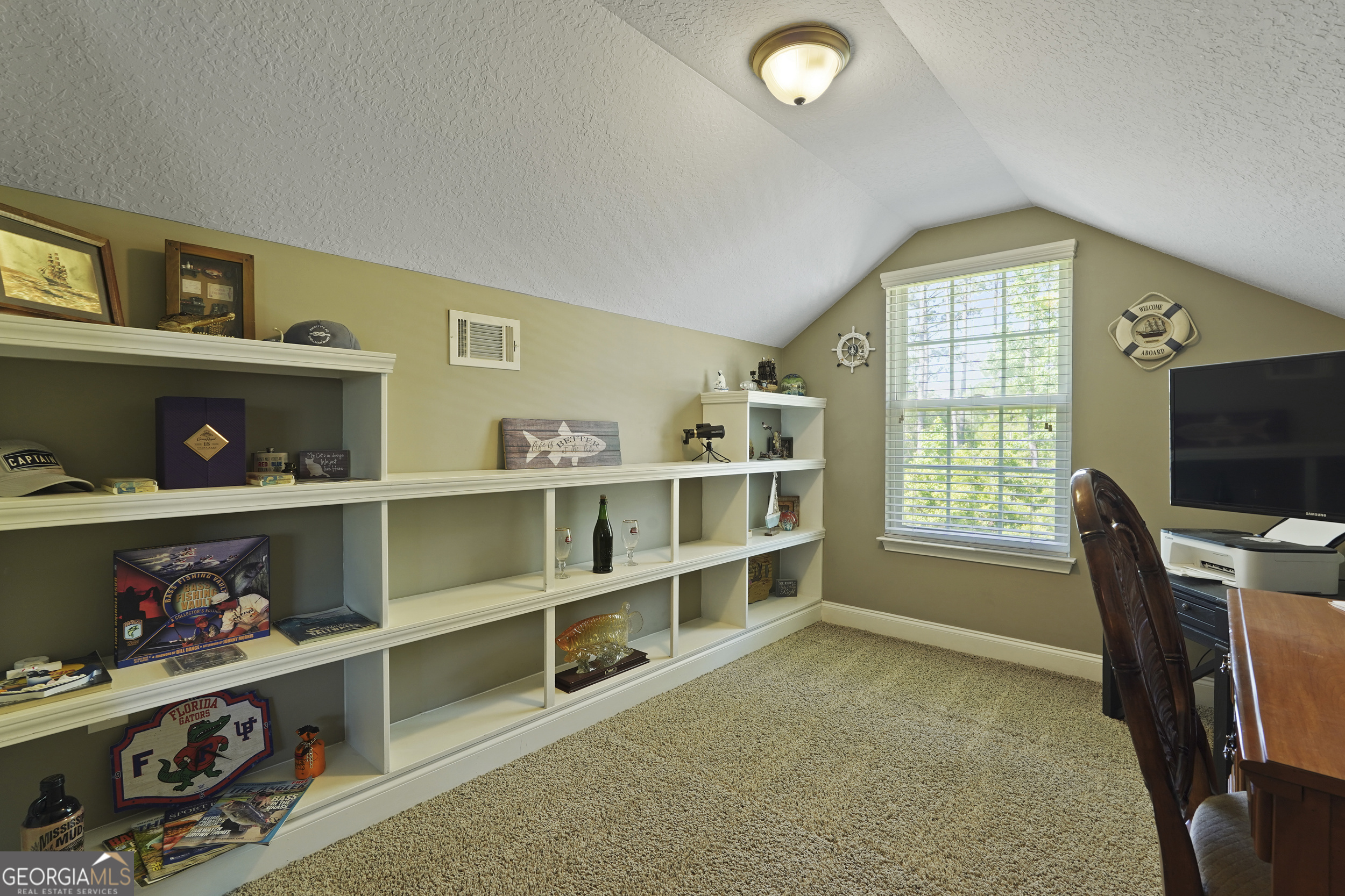 1653 Sutherland Road Townsend, GA 31331 - Photo 52 of 73 a workspace with furniture bookshelf and a window