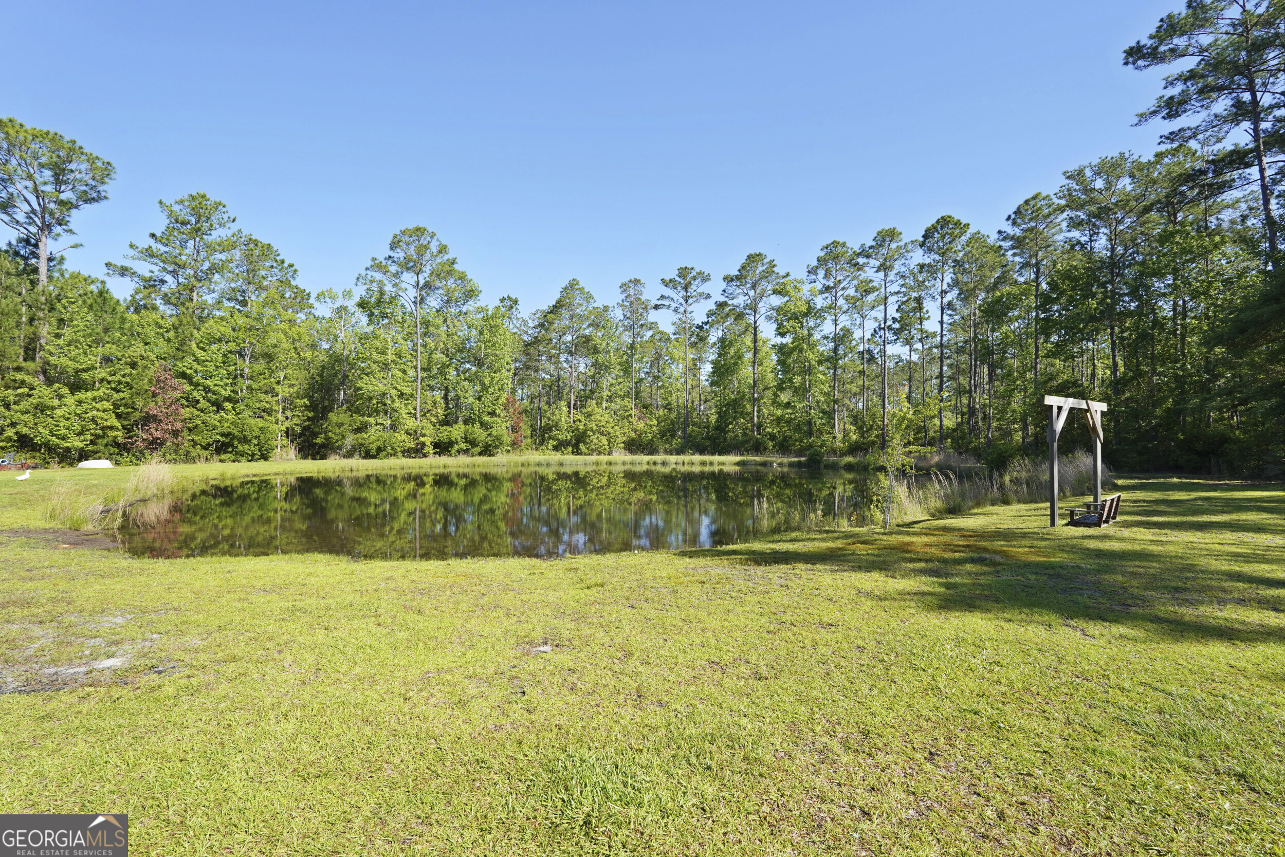 1653 Sutherland Road Townsend, GA 31331 - Photo 63 of 73 a view of a lake with a big yard