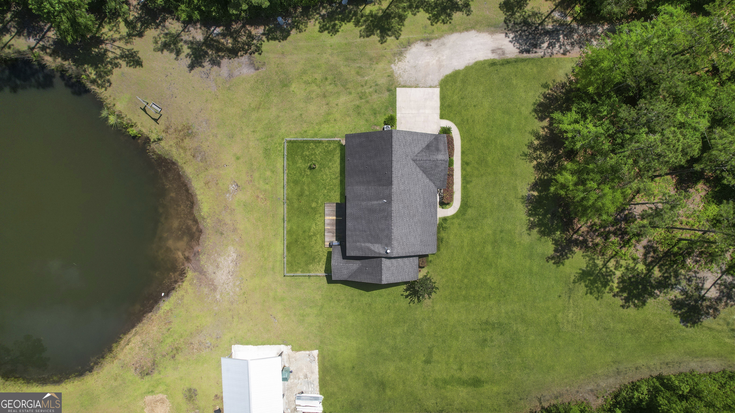 1653 Sutherland Road Townsend, GA 31331 - Photo 68 of 73 an aerial view of a house with a yard swimming pool and outdoor seating