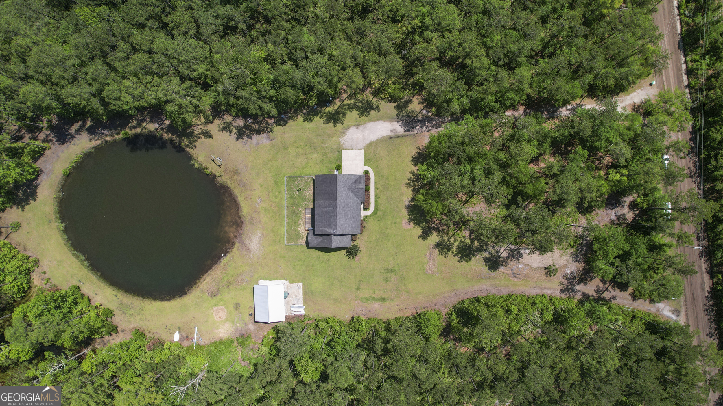 1653 Sutherland Road Townsend, GA 31331 - Photo 69 of 73 an aerial view of a house with a yard and trees all around