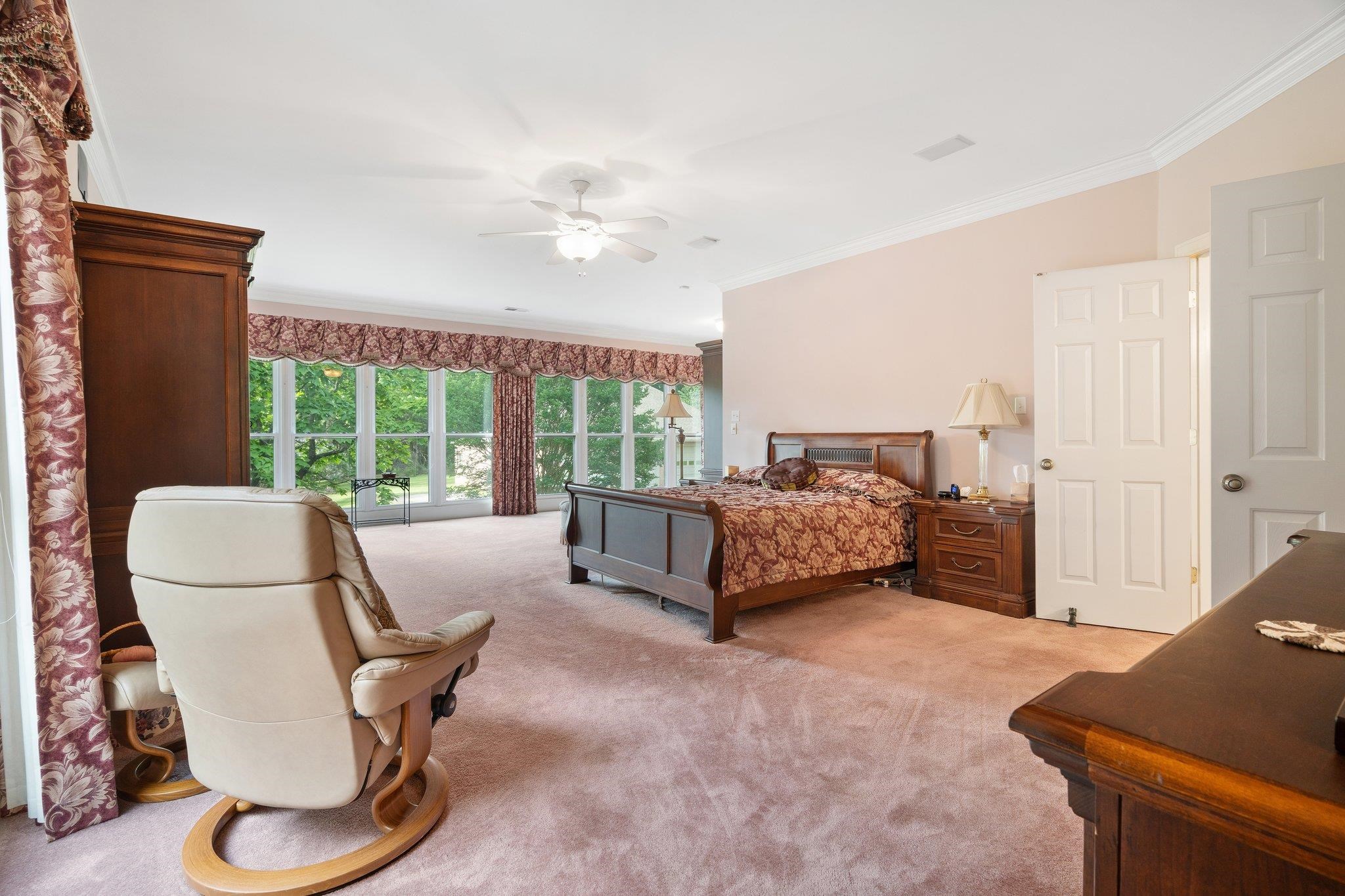6500 State Line Road Memphis, TN 38141 - Photo 11 of 40 Bedroom featuring crown molding, light carpet, and a ceiling fan