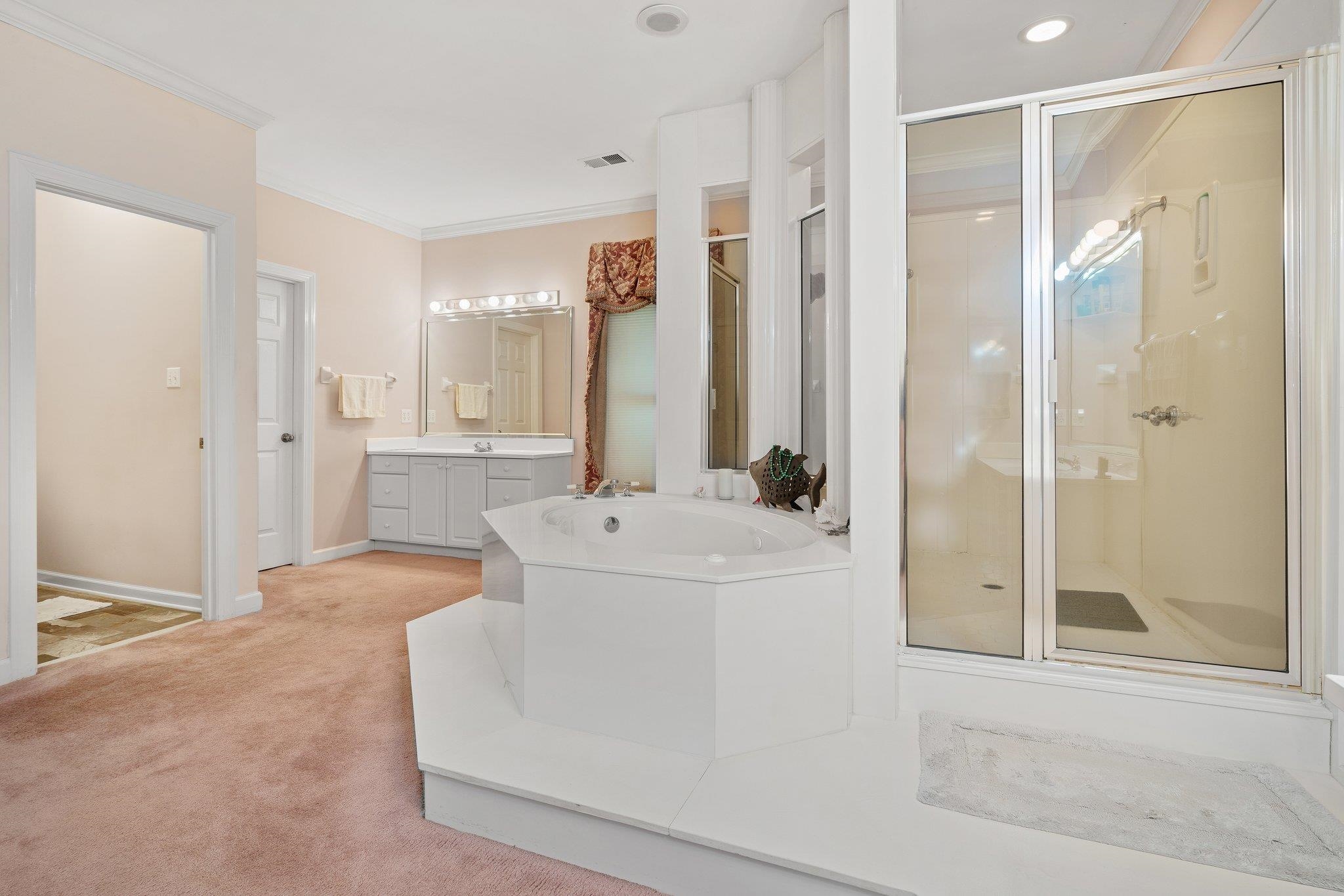 6500 State Line Road Memphis, TN 38141 - Photo 14 of 40 Bathroom featuring vanity, a stall shower, ornamental molding, a bath, and recessed lighting