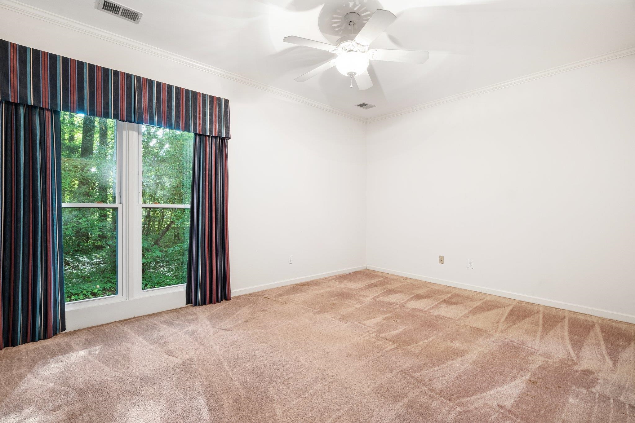 6500 State Line Road Memphis, TN 38141 - Photo 16 of 40 Carpeted empty room featuring crown molding and a ceiling fan