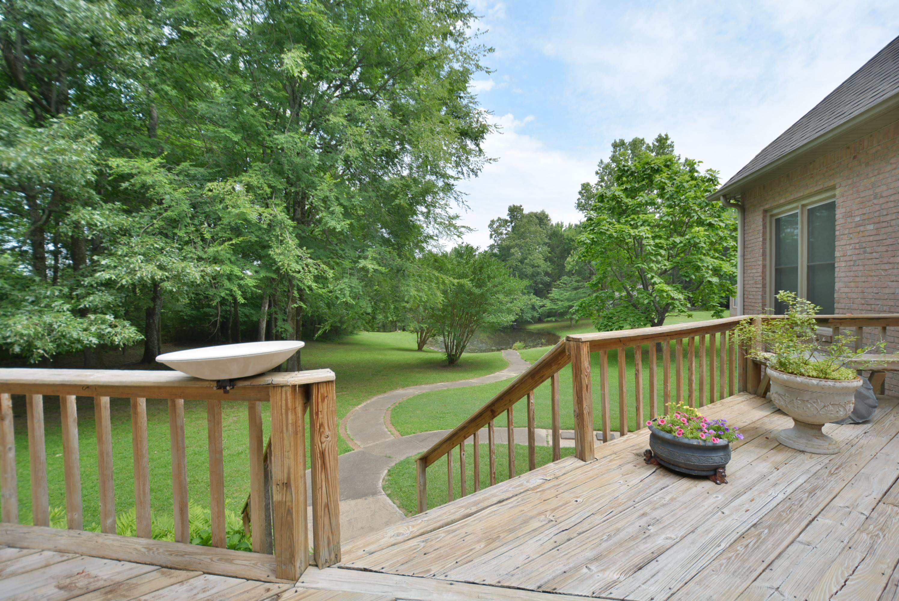 6500 State Line Road Memphis, TN 38141 - Photo 27 of 40 Wooden terrace featuring a yard