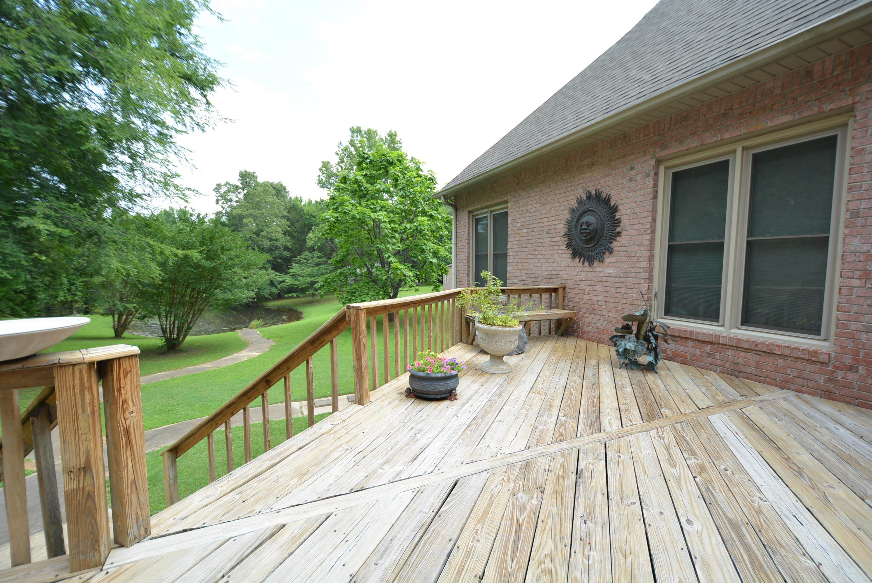 6500 State Line Road Memphis, TN 38141 - Photo 28 of 40 Deck featuring a lawn