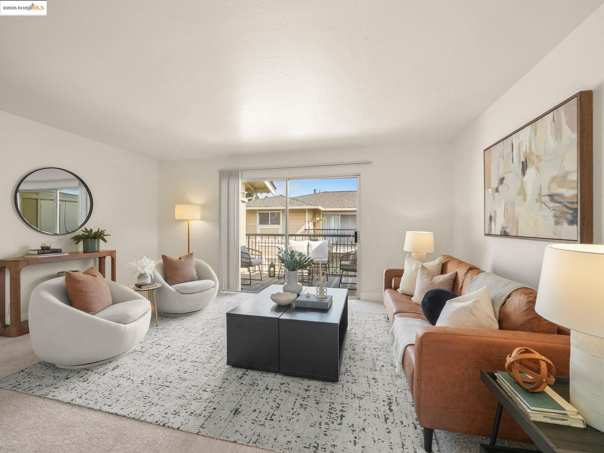 a living room with furniture and a large window