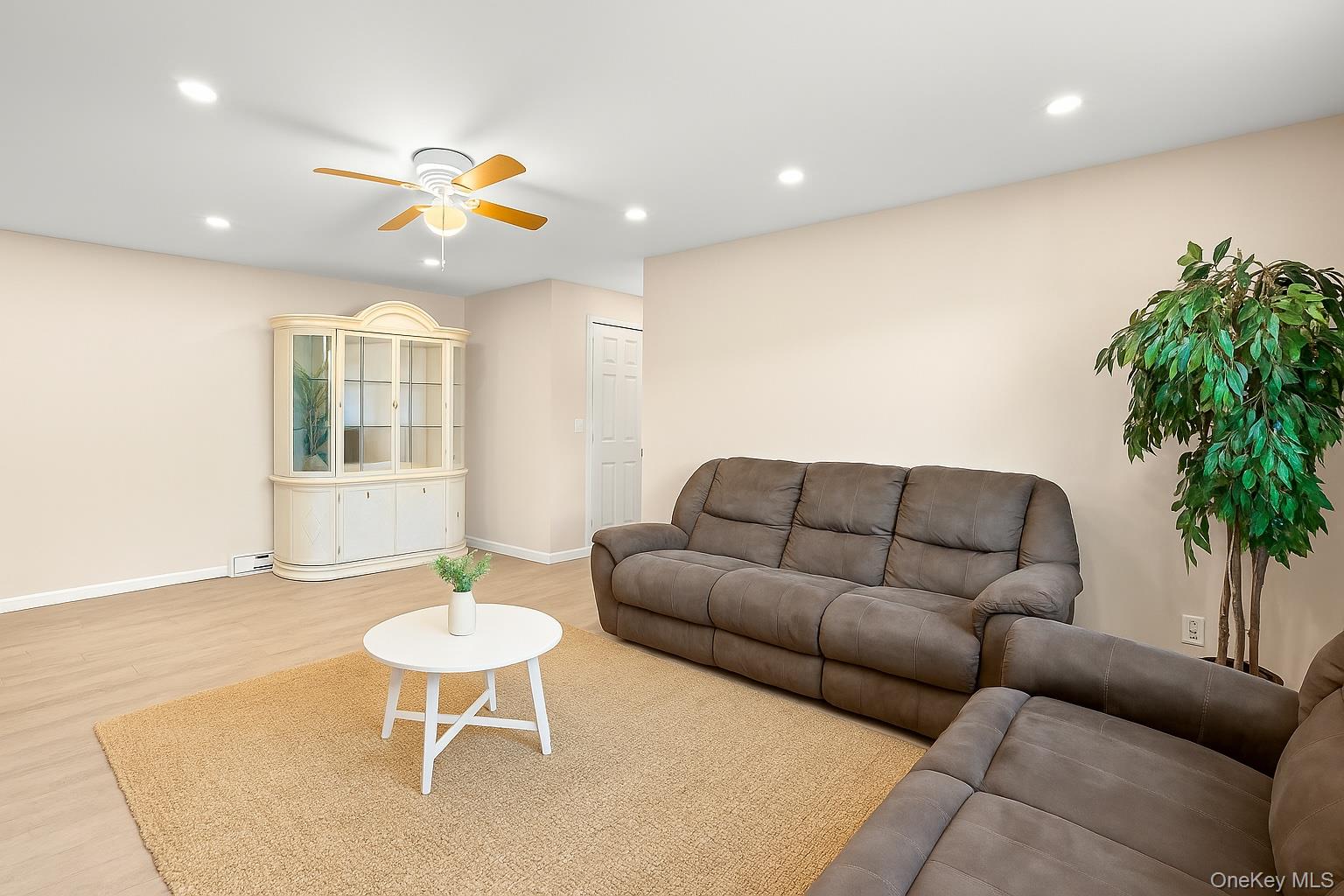 400 Maryland Avenue, Unit 1D Staten Island, NY 10305 - Photo 5 of 19 a living room with furniture and a potted plant