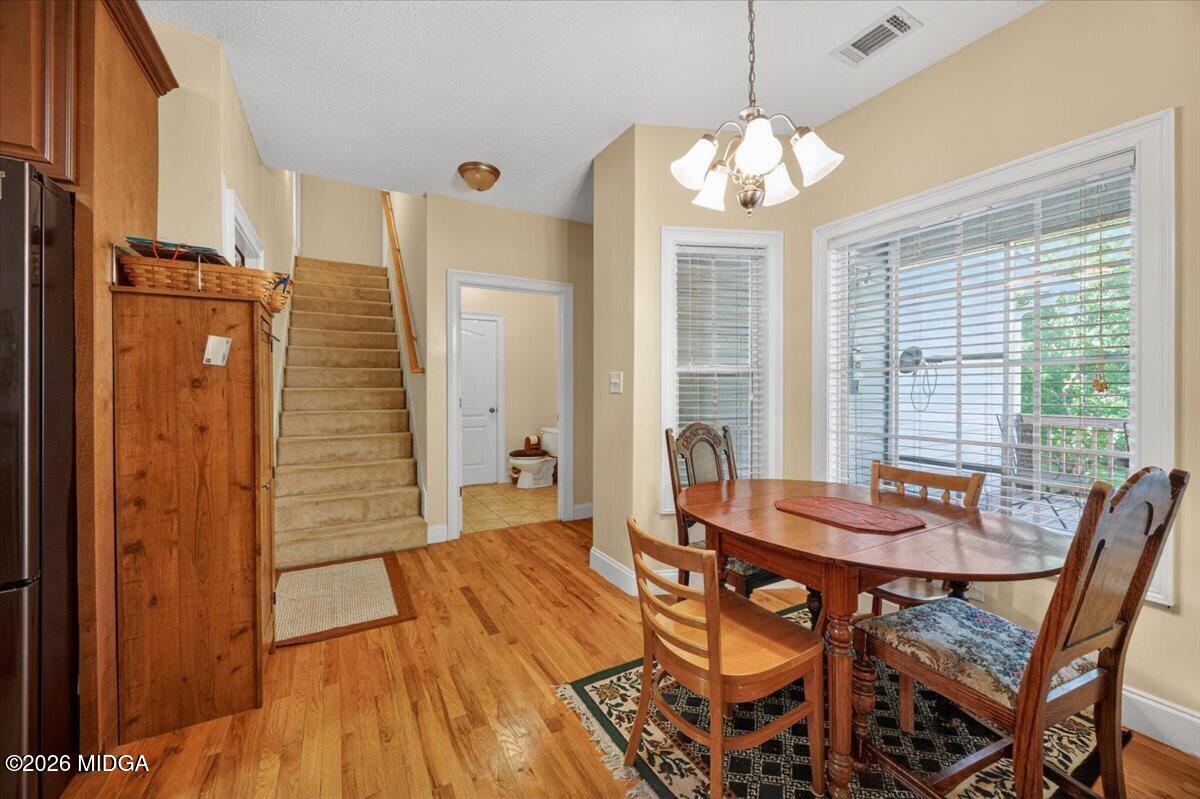 619 Grayridge Road Gray, GA 31032 - Photo 15 of 40 a dining room with furniture and window