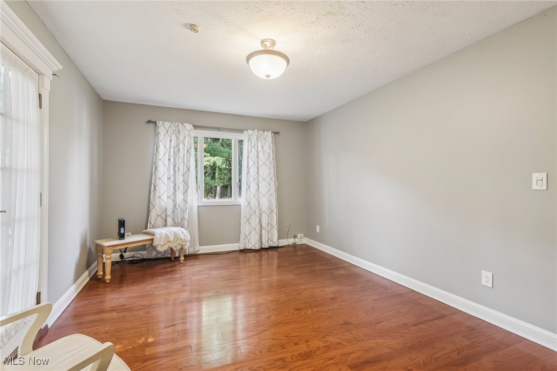 18336 Falling Water Road Strongsville, OH 44136 - Photo 29 of 50 Sitting room featuring wood finished floors and a textured ceiling