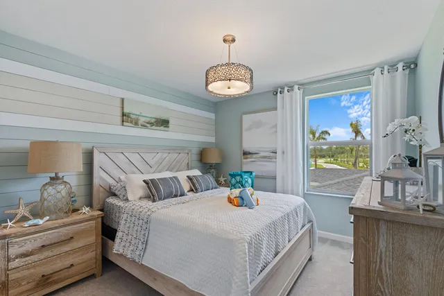 a bedroom with bed and wooden floor