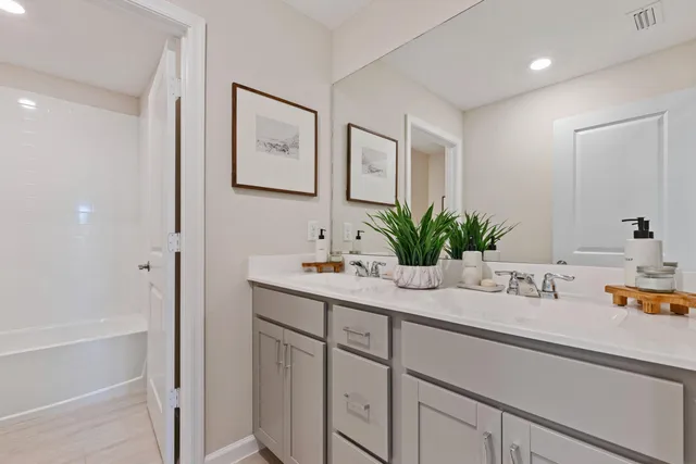 a bathroom with a sink a vanity and a mirror
