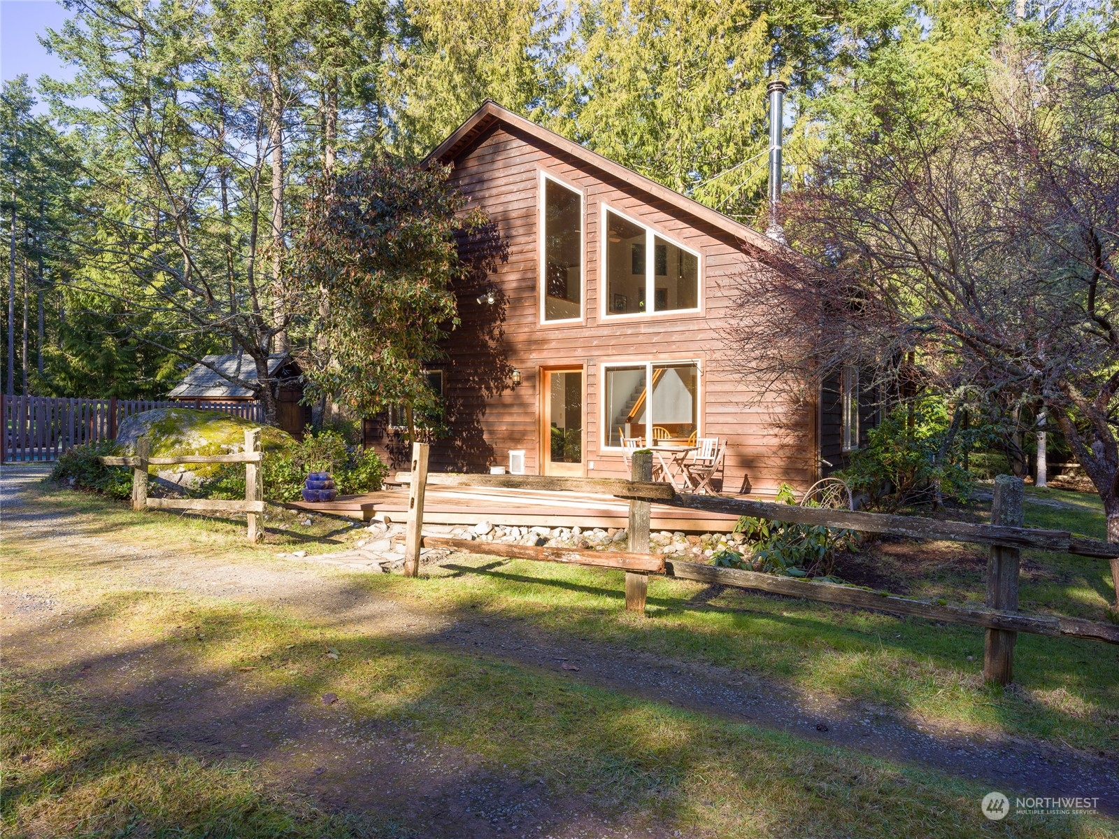 83 Eliza Road Lopez Island, WA 98261 - Photo 1 of 1 a view of a house with pool and sitting area