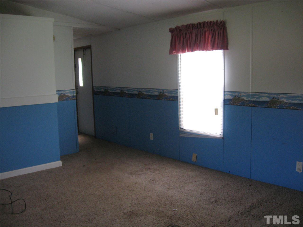 925 C Micro Road West Selma, NC 27576 - Photo 11 of 11 Living room and kitchen have open floor plan.