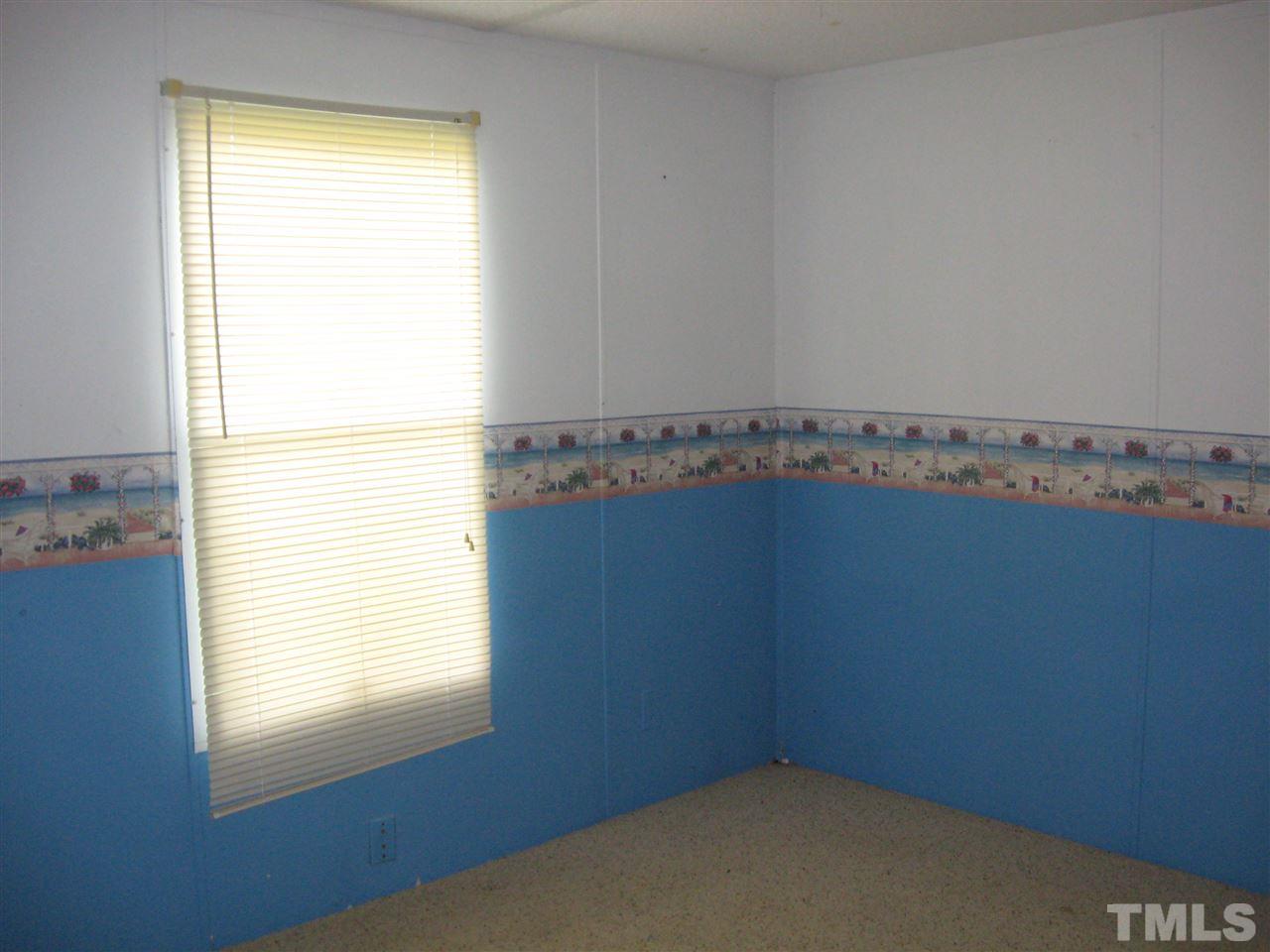 Master bedroom appears in good condition.