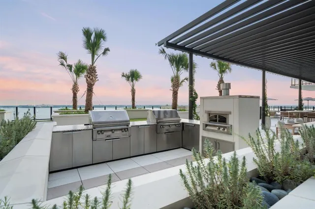 a building outdoor space with patio furniture and potted plants