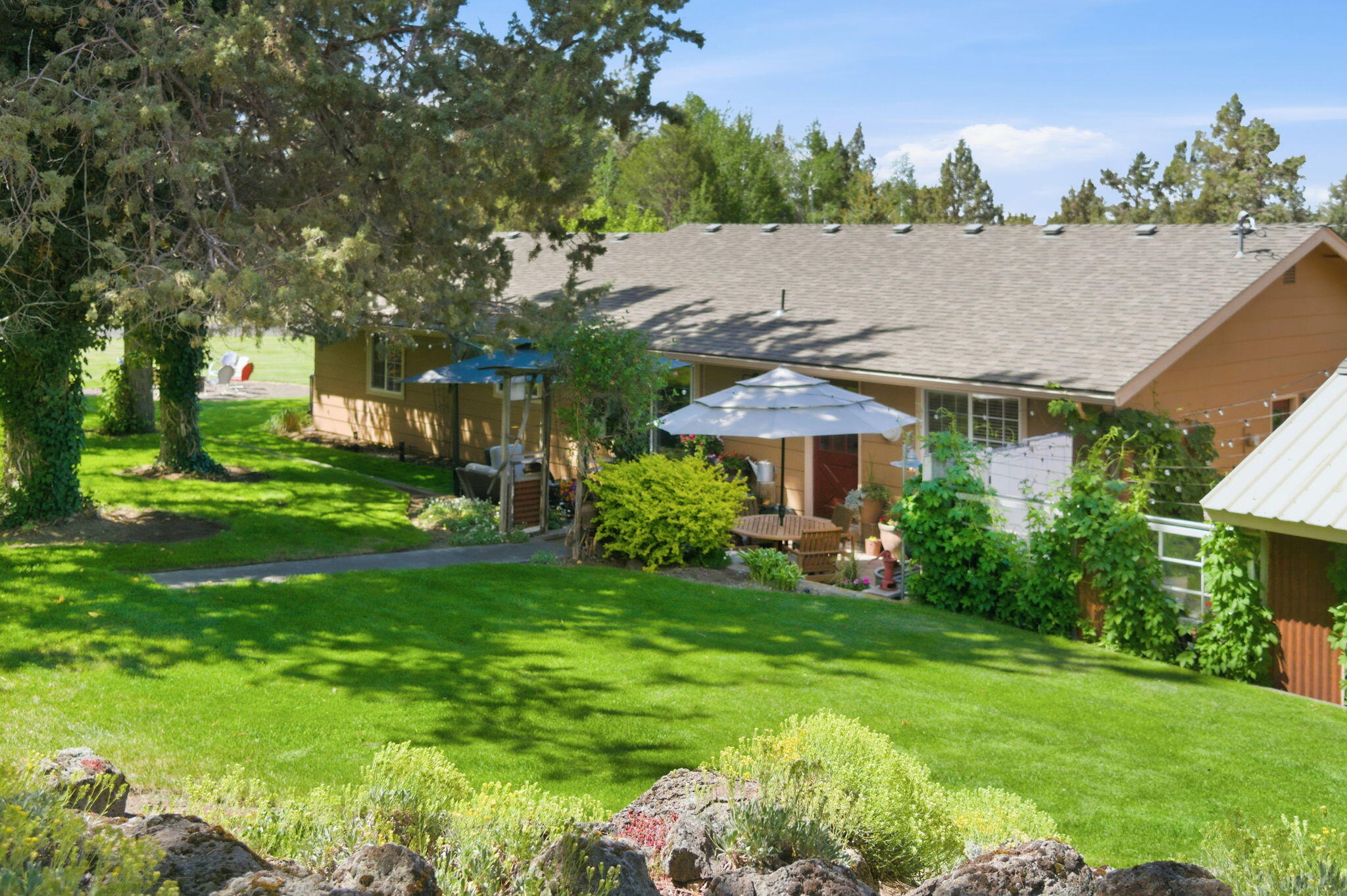 22539 Martee Lane Bend, OR 97701 - Photo 42 of 54 a view of a house with a garden