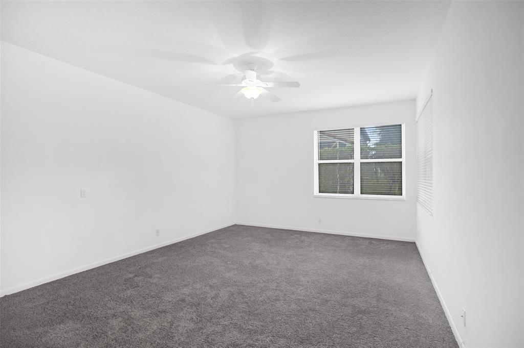 6463 Colomera Drive Boca Raton, FL 33433 - Photo 12 of 29 an empty room with windows and fan