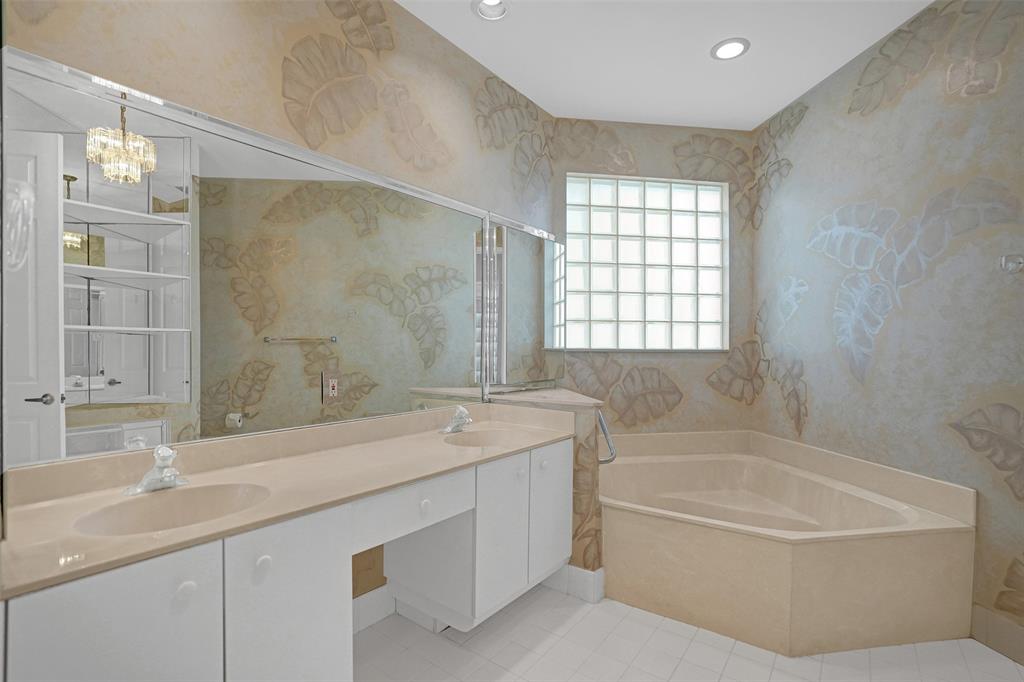 6463 Colomera Drive Boca Raton, FL 33433 - Photo 14 of 29 a bathroom with a granite countertop sink a toilet and bathtub