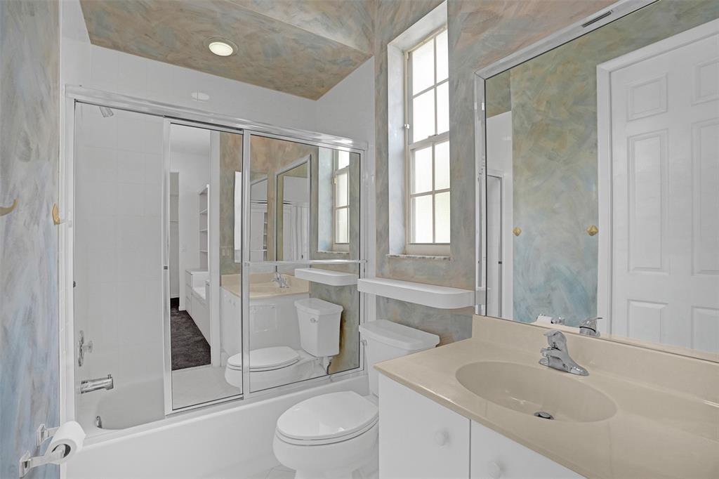 6463 Colomera Drive Boca Raton, FL 33433 - Photo 18 of 29 a bathroom with a sink a toilet and shower