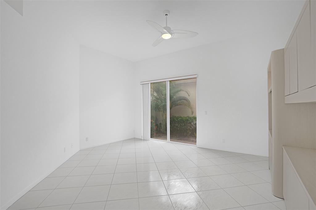 6463 Colomera Drive Boca Raton, FL 33433 - Photo 24 of 29 an empty room with entrance and mirror