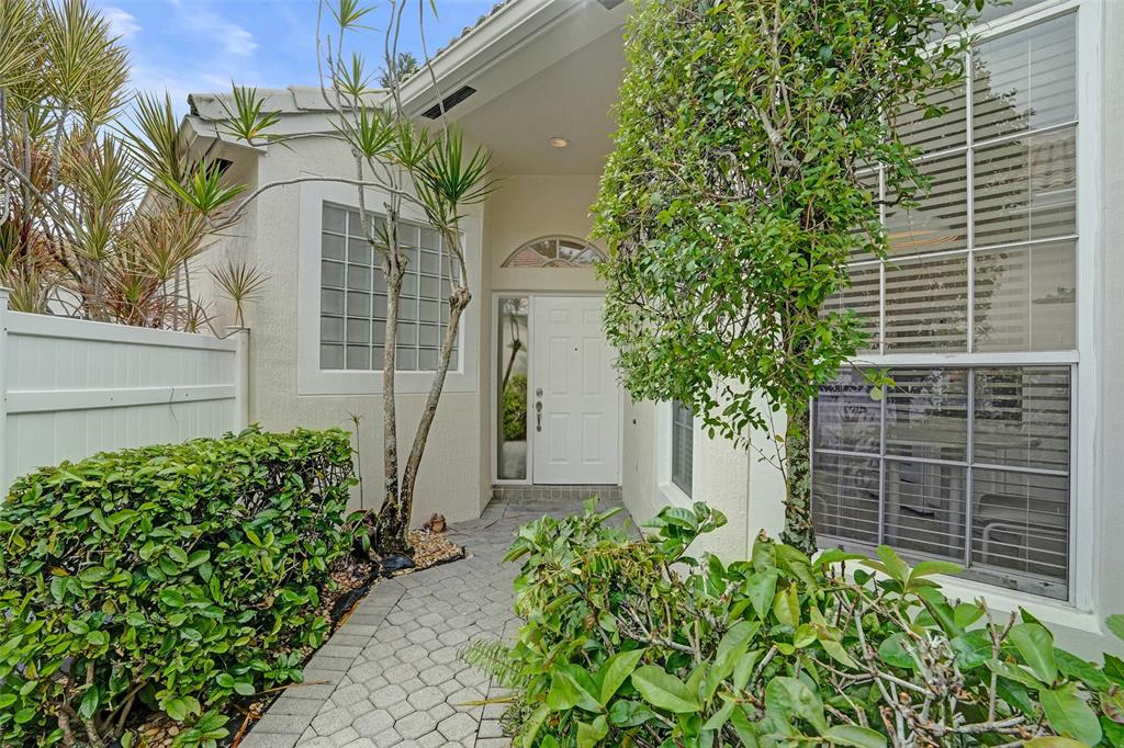 6463 Colomera Drive Boca Raton, FL 33433 - Photo 3 of 29 a plant that is in front of a house