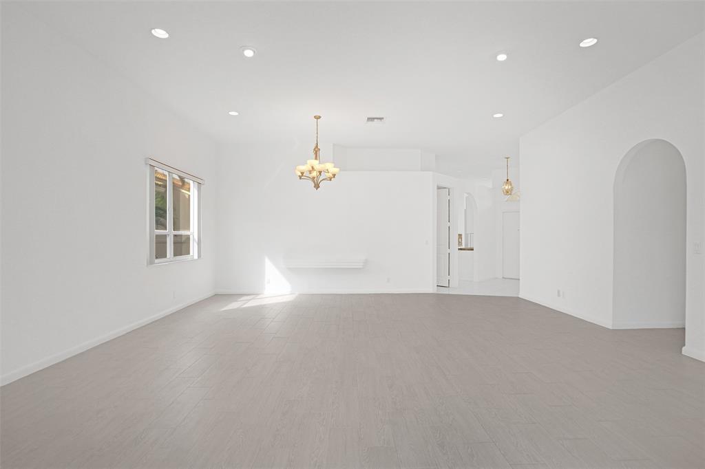 6463 Colomera Drive Boca Raton, FL 33433 - Photo 4 of 29 an empty room with a empty space and windows