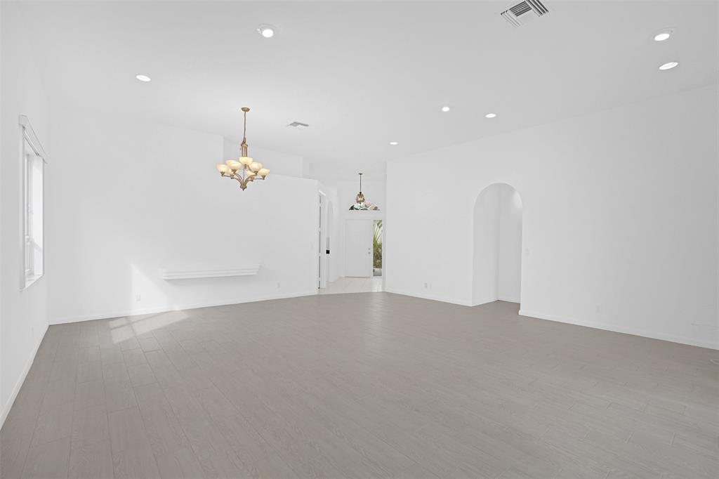 6463 Colomera Drive Boca Raton, FL 33433 - Photo 6 of 29 an empty room with a ceiling fan and window