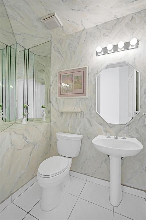 6463 Colomera Drive Boca Raton, FL 33433 - Photo 7 of 29 a bathroom with a toilet sink and mirror