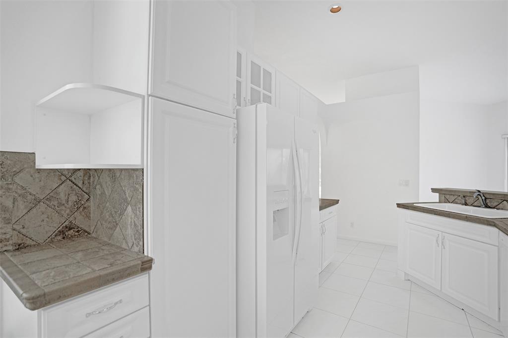 6463 Colomera Drive Boca Raton, FL 33433 - Photo 9 of 29 a kitchen with a sink and cabinets