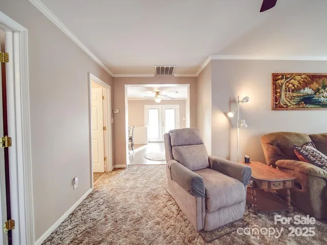 a living room with furniture and a rug