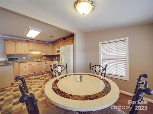 a view of a kitchen with granite countertop a sink and a granite counter top