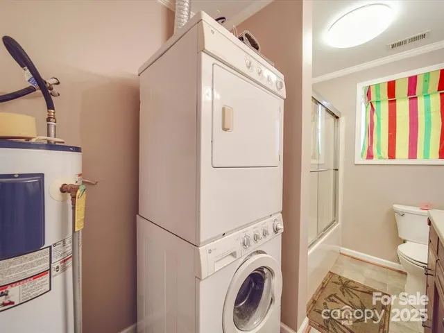 a view of a hallway with washer and dryer