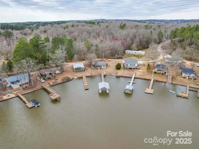 an aerial view of a house with outdoor space