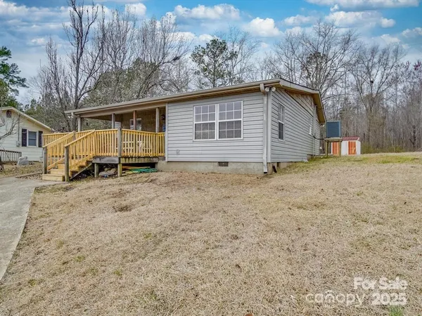 a view of a house with a yard and garage