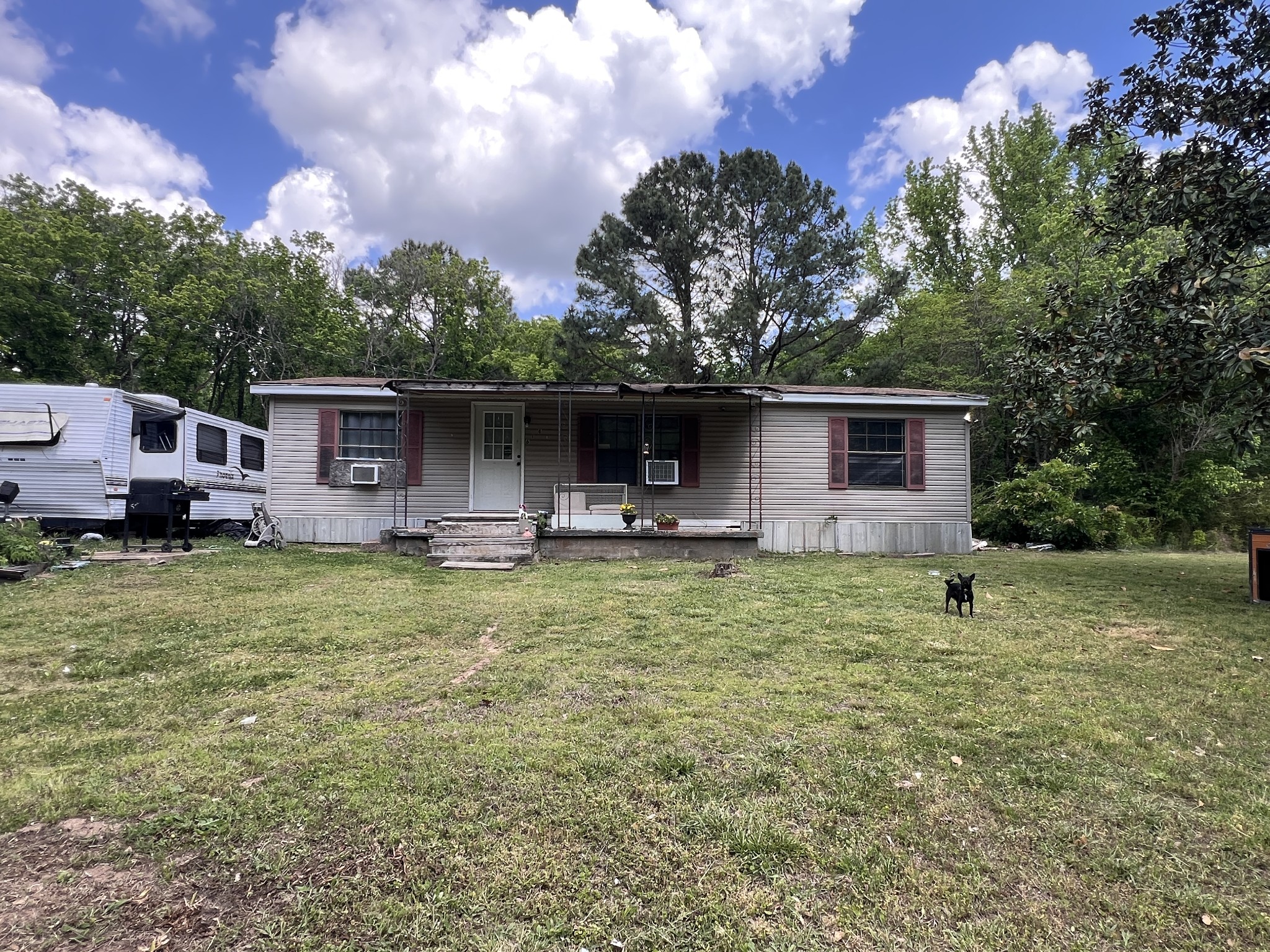 a front view of house with yard and trees