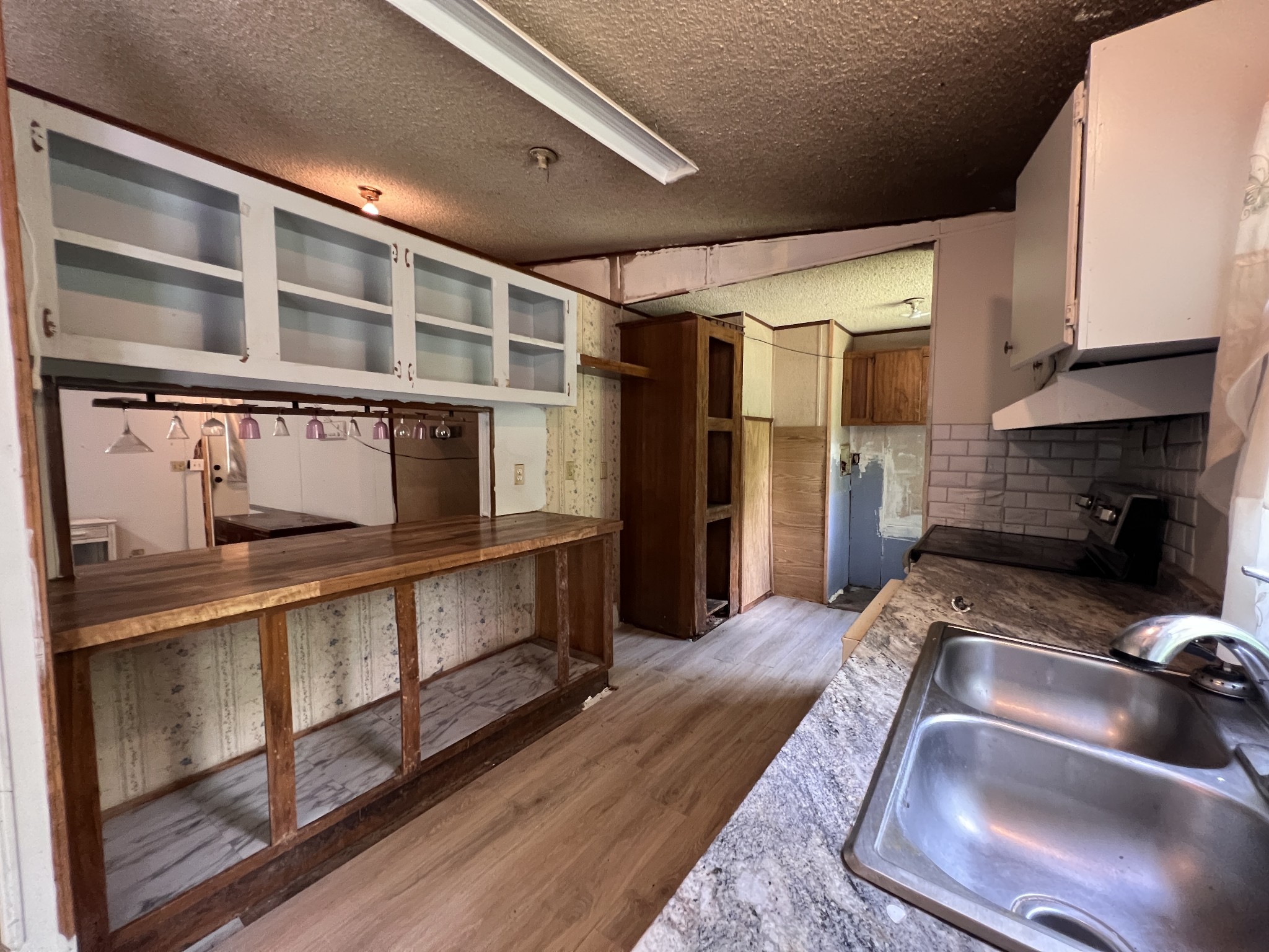 616 Powell Street Paris, TN 38242 - Photo 12 of 26 a kitchen with stainless steel appliances granite countertop a stove and a refrigerator