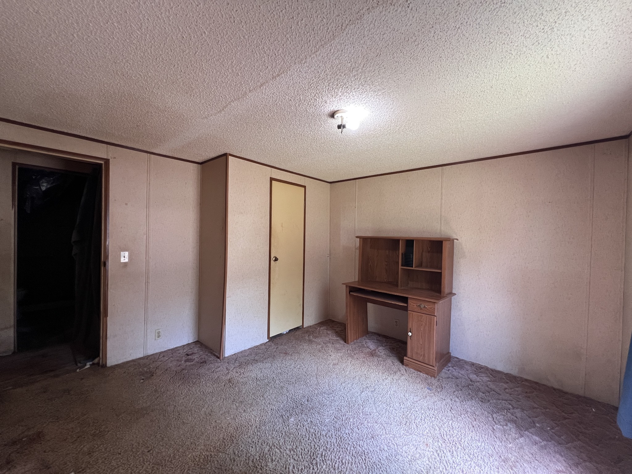 616 Powell Street Paris, TN 38242 - Photo 18 of 26 a view of empty room with a fireplace