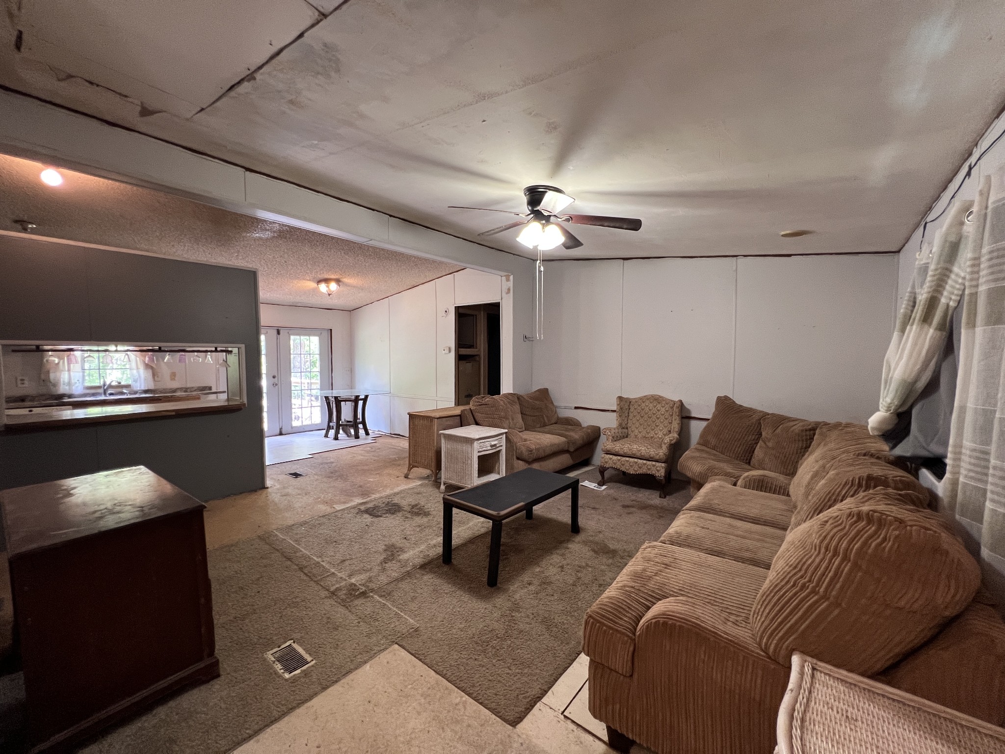 616 Powell Street Paris, TN 38242 - Photo 7 of 26 a living room with furniture ceiling fan and a rug