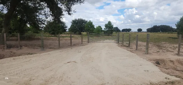 a view of a lake with a yard