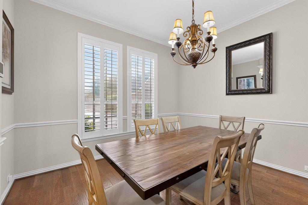 7625 Ridgedale Court Sachse, TX 75048 - Photo 8 of 40 AI, Dining space featuring ornamental molding, hanging lights, and dark wood finished floors