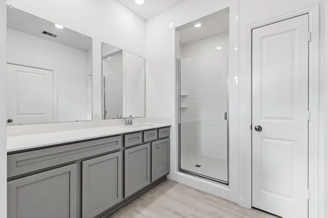 a view of a workspace with furniture and a flat screen tv