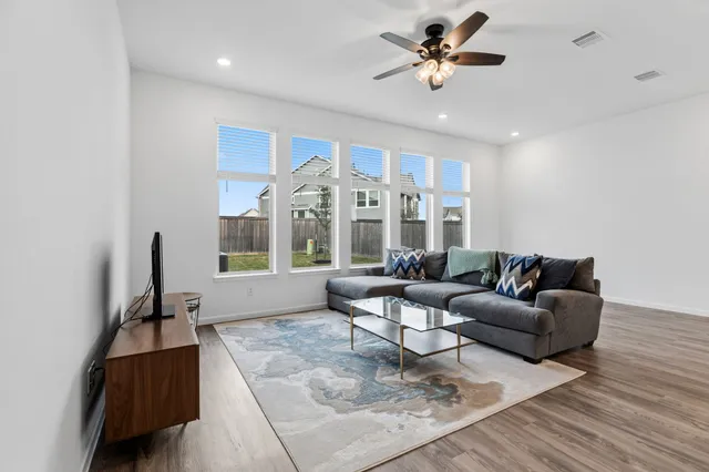 a kitchen with stainless steel appliances granite countertop a sink a stove and a microwave