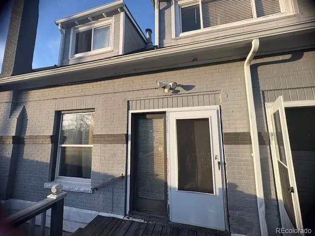 a view of a living room filled with furniture and a rug