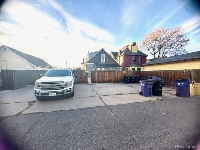 a view of a car parked in front of a building