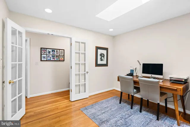 a bedroom with a bed and a desk